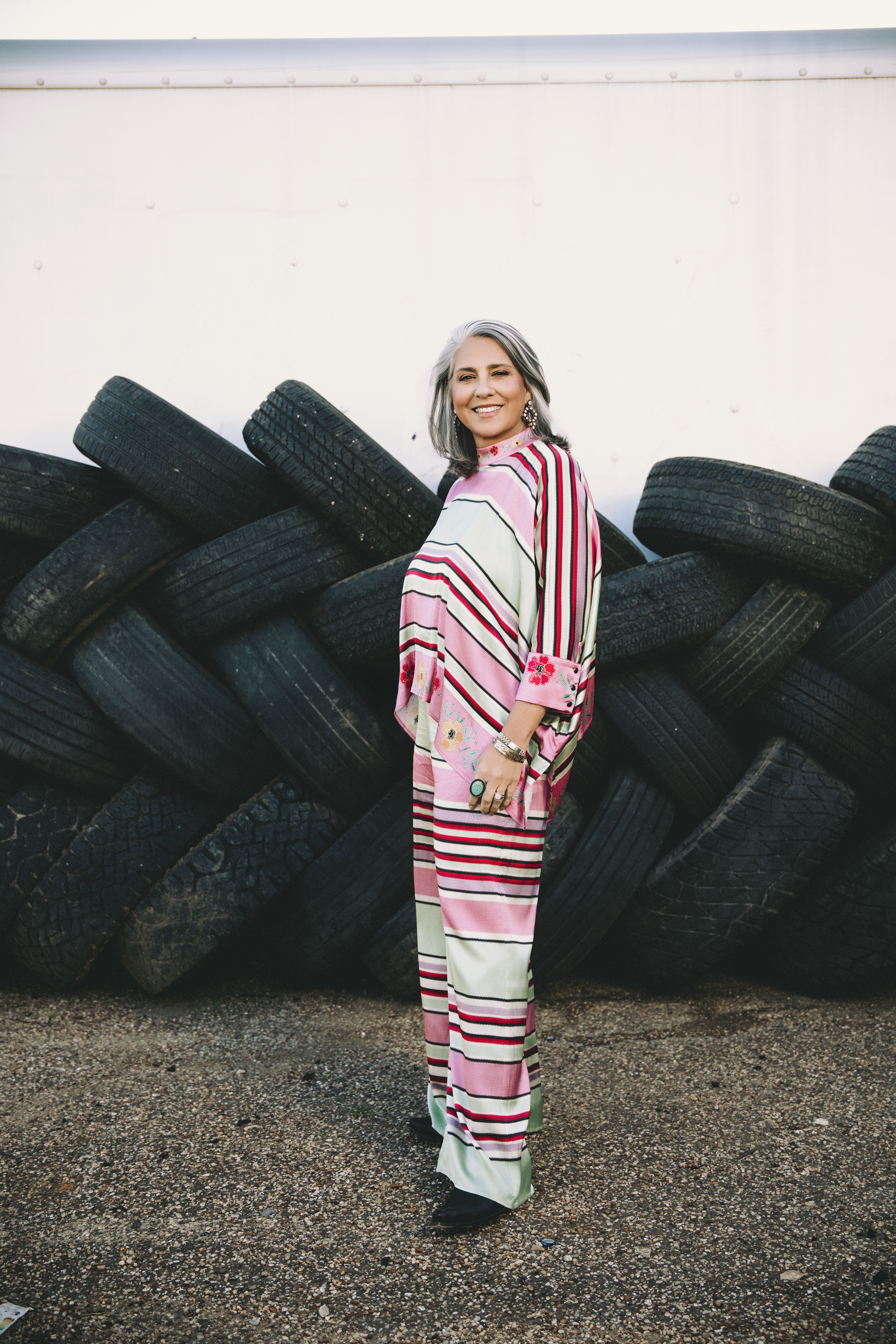 Audrey wearing the Round Top Serape Poncho and Pants with Double D Ranch jewelry and accessories.