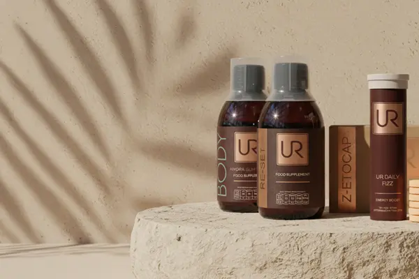 Urban Retreat wellbeing products on a textured surface with shadows.