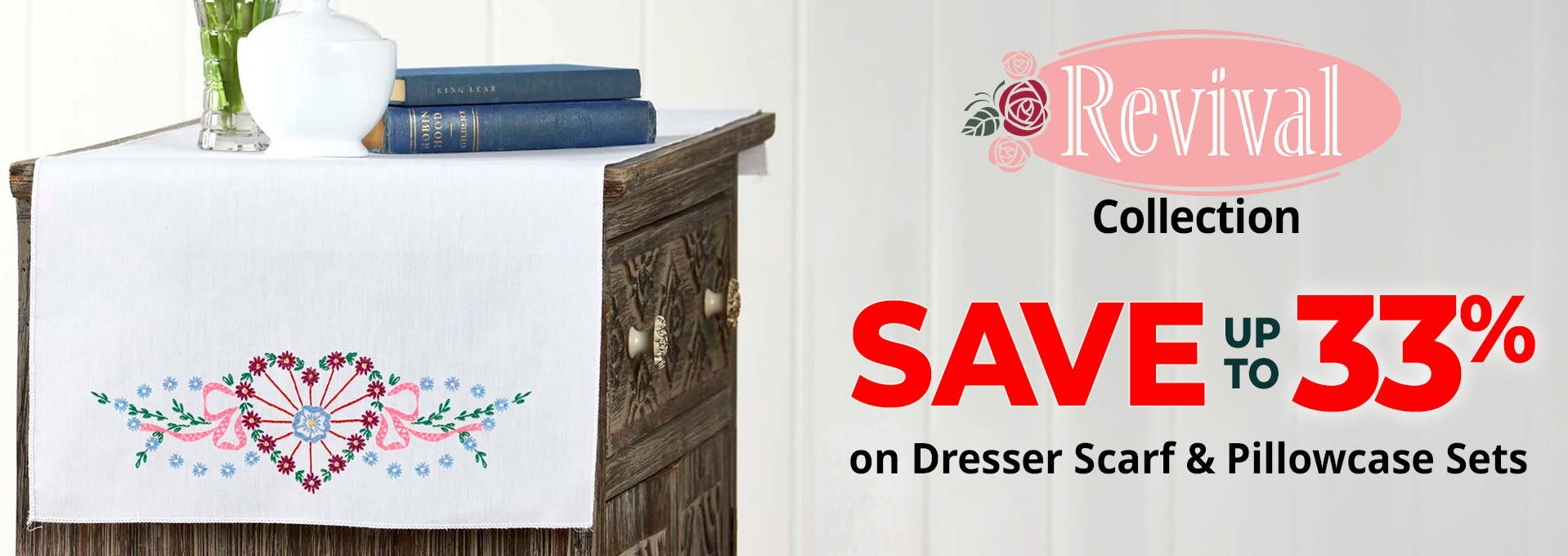 Text: Revival Collection — Save Up to 33% on Dresser Scarf & Pillowcase Sets. Image: Herrschners Josephine Dresser Scarf Stamped Embroidery.