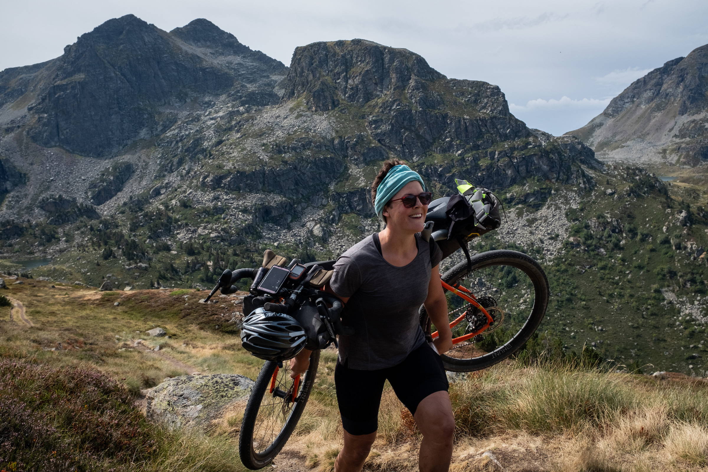 Philippa carrying her bike over her shoulders