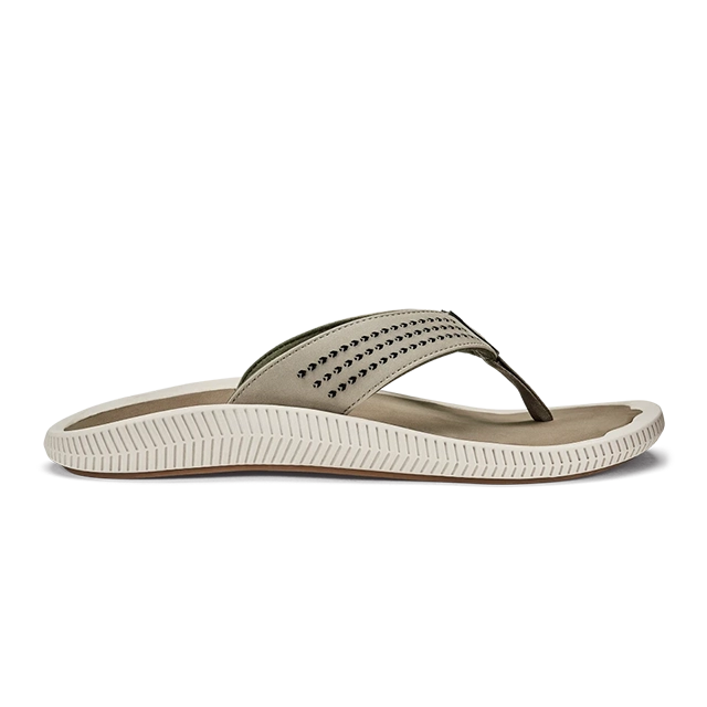 A side view of a green flip-flop sandal with a textured strap.