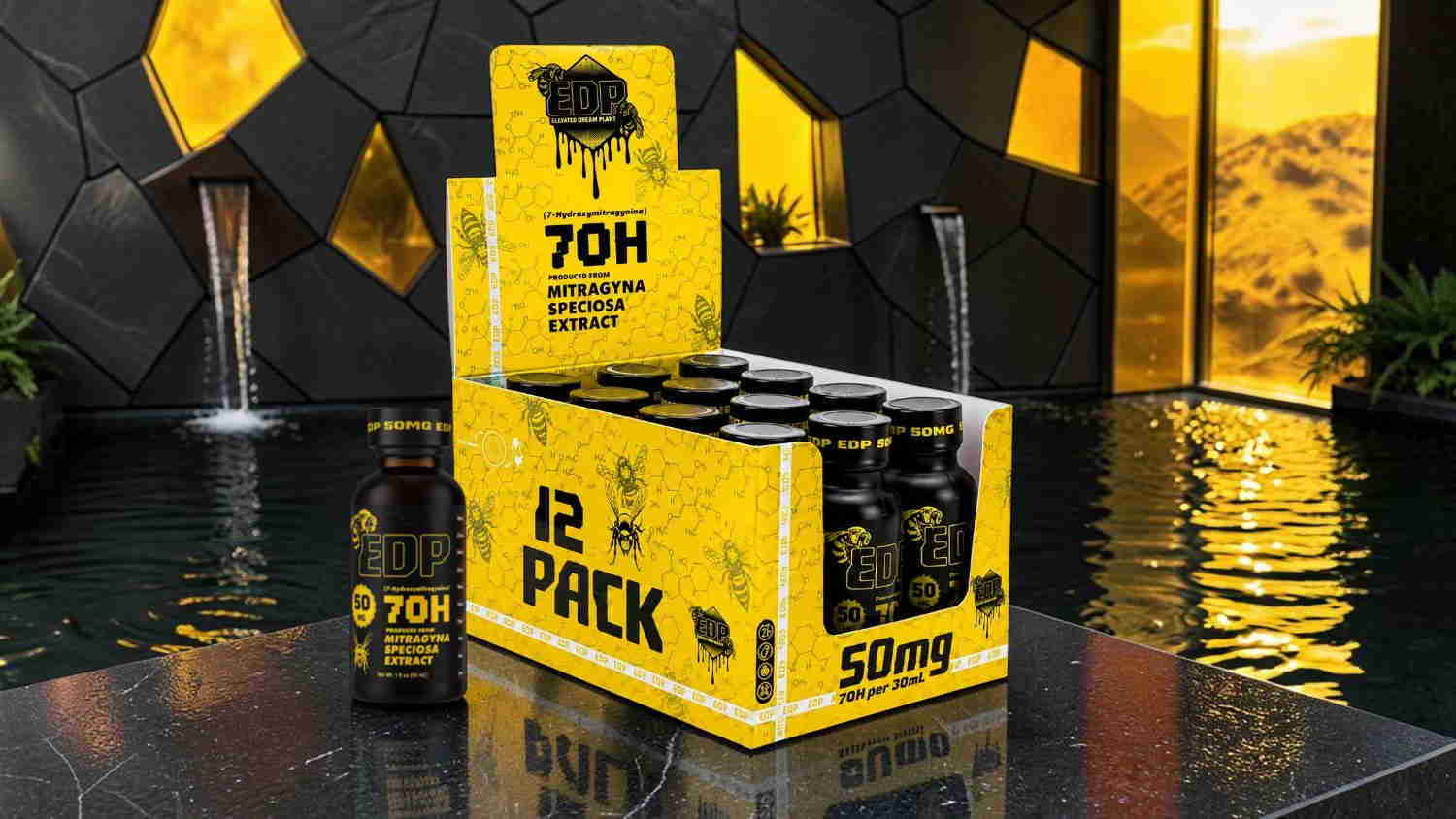 A box of drinks with a yellow design, placed near a water feature.