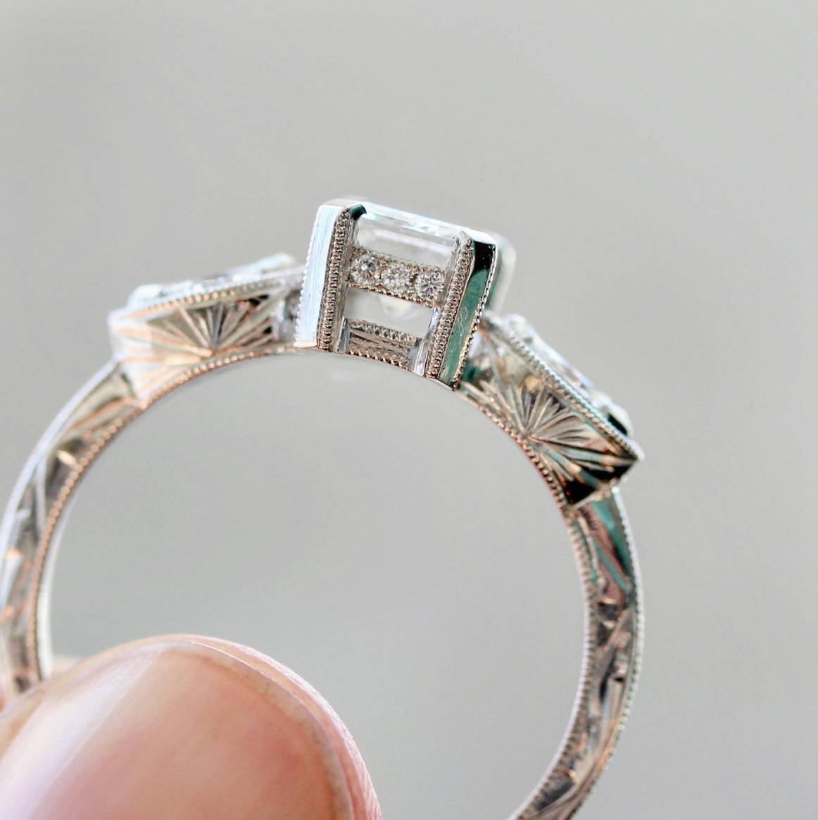White gold diamond ring with engraving on side
