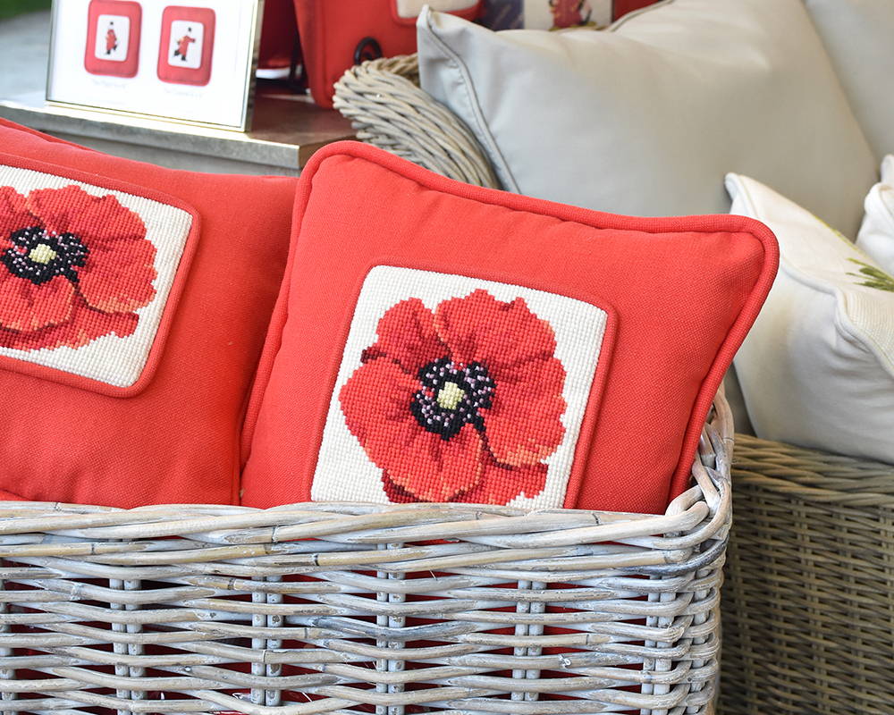 Chelsea Poppy pillows in basket close up