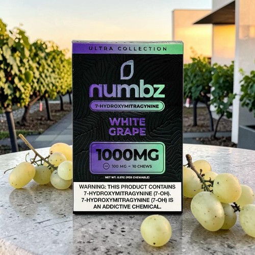 Packaging of Numbz White Grape product with grapes in the background.