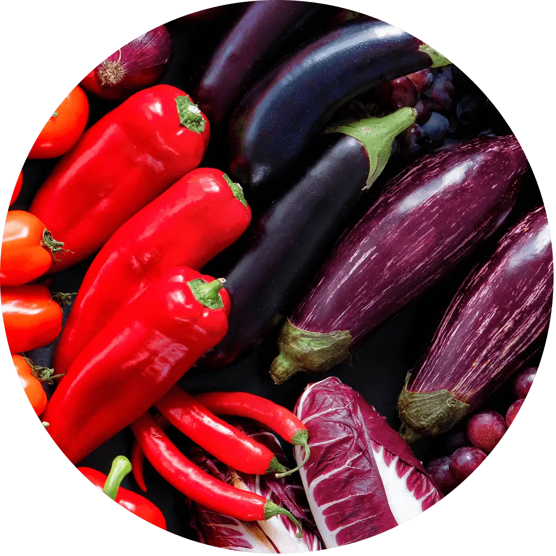 purple and blue fruit and vegetables including peppers and eggplants.