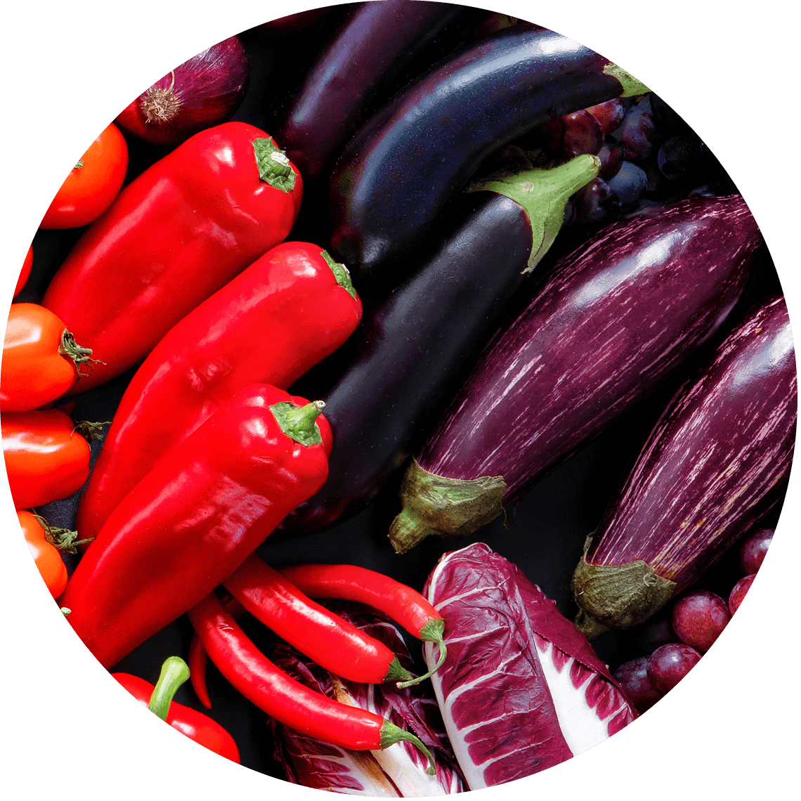 purple and blue fruit and vegetables including peppers and eggplants.