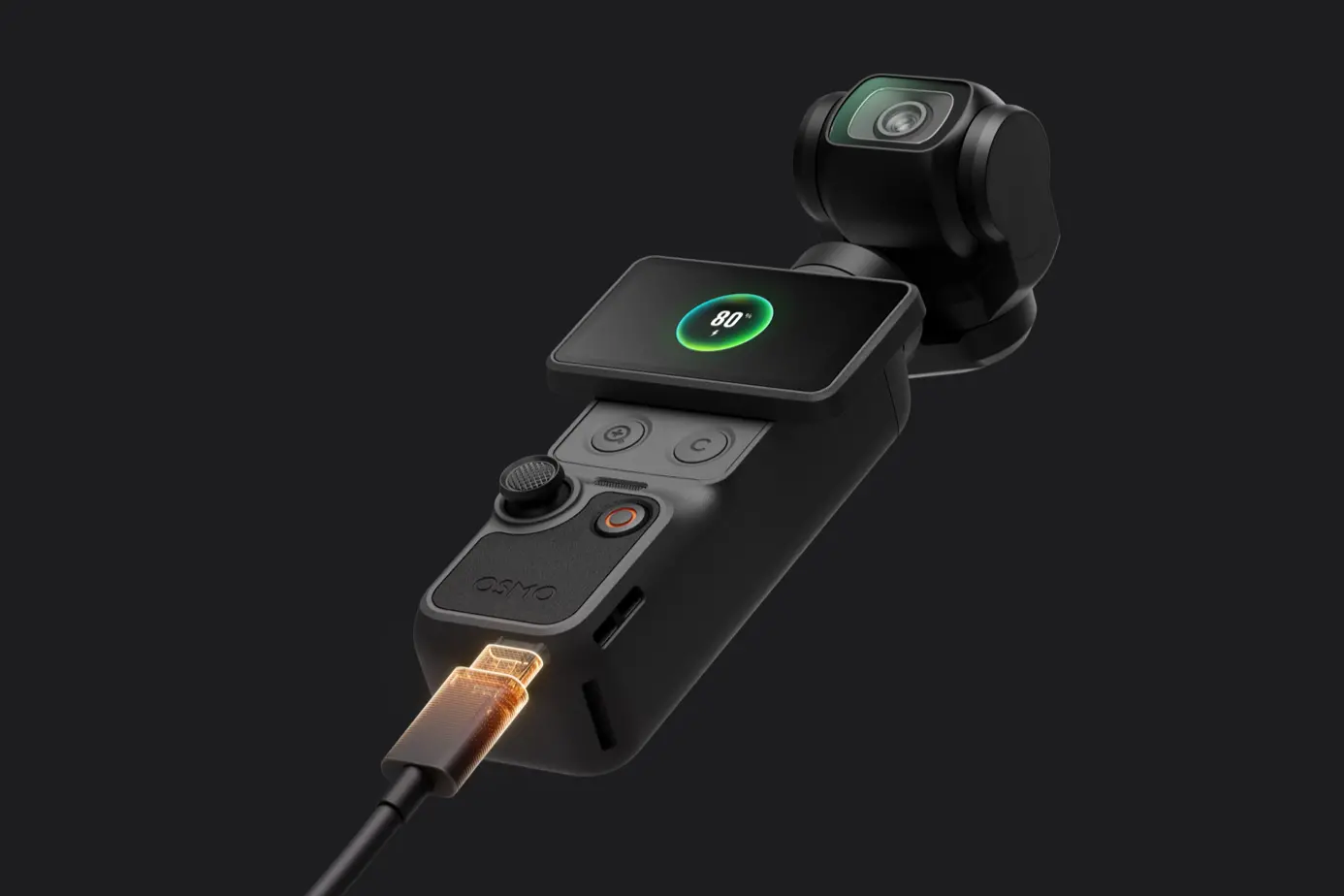 The Osmo Pocket 4 plugged in to charge, the screen displays 