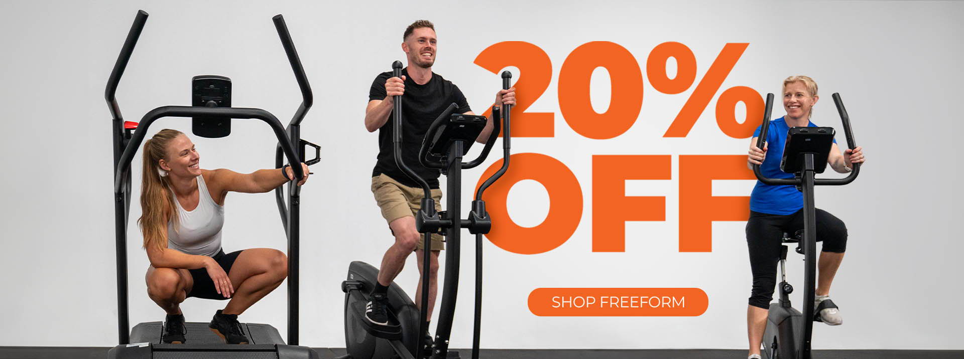 Freeform Cardio Sale - Three people exercising on a Freeform elliptical machine, Freeform manual treadmill and Freeform upright bike, with smiles, against a grey background. Text overlay reads '20% OFF' in large orange letters, with 'SHOP FREEFORM' underneath it.