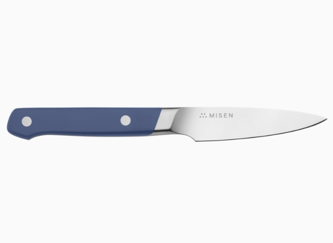 A blue Misen Paring Knife seen from the side, with the Misen logo visible at the base of the knife’s spine.
