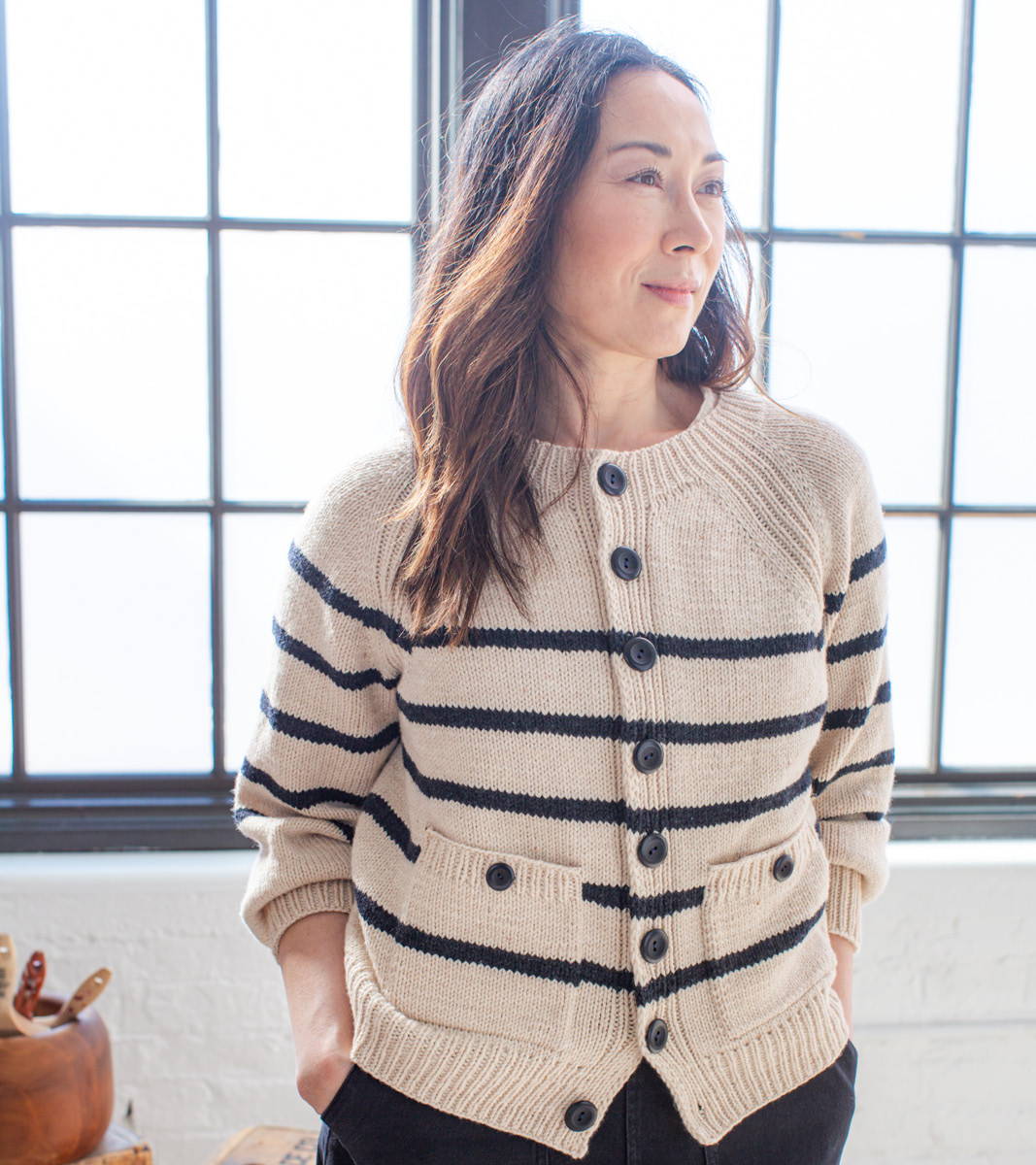 Laura modeling First Cardigan Sweater sample in Crepe & Carbon stripes
