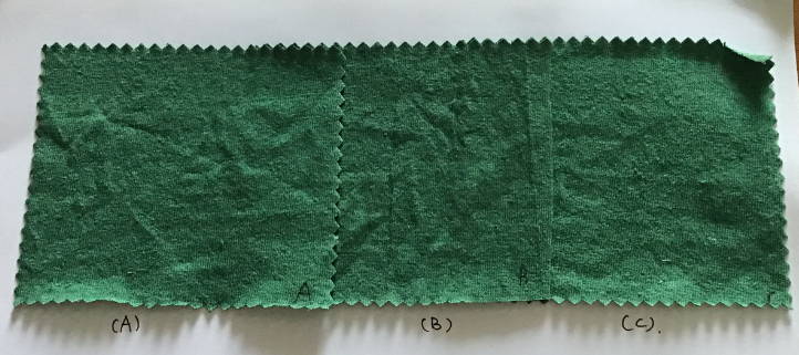 Three green WAMA hemp fabric samples sit next to one another.