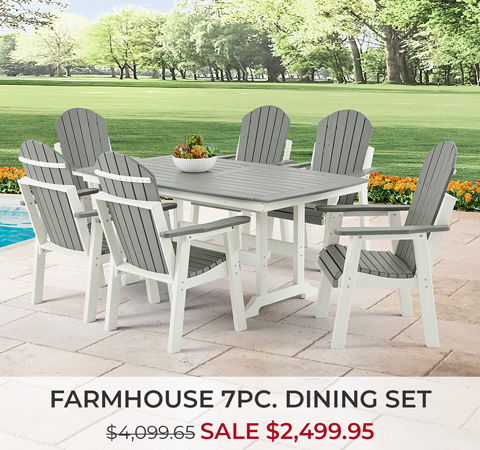 Farmhouse 7-piece dining set on a patio with green background.