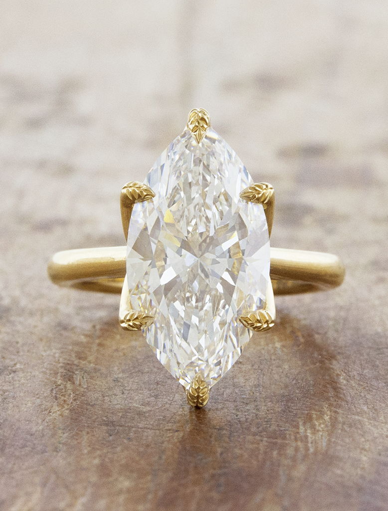 caption:Shown with 4ct marquise diamond in 18k yellow gold