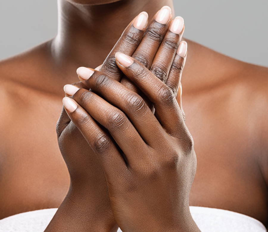 woman moisturizing hands