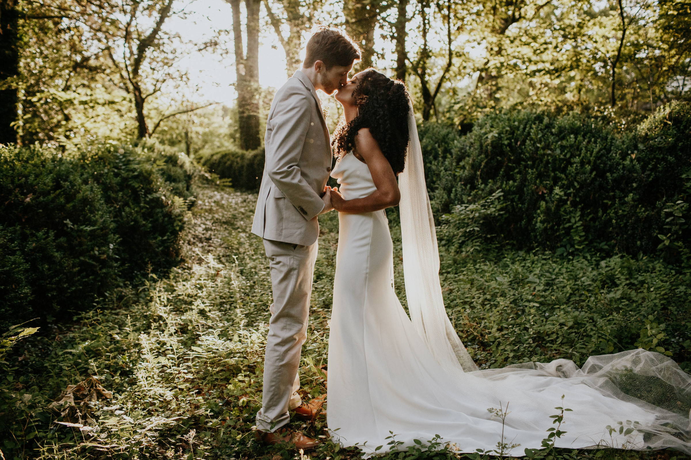 Grace Loves Lace bride in the Honey Silk Gown kissing her new husband