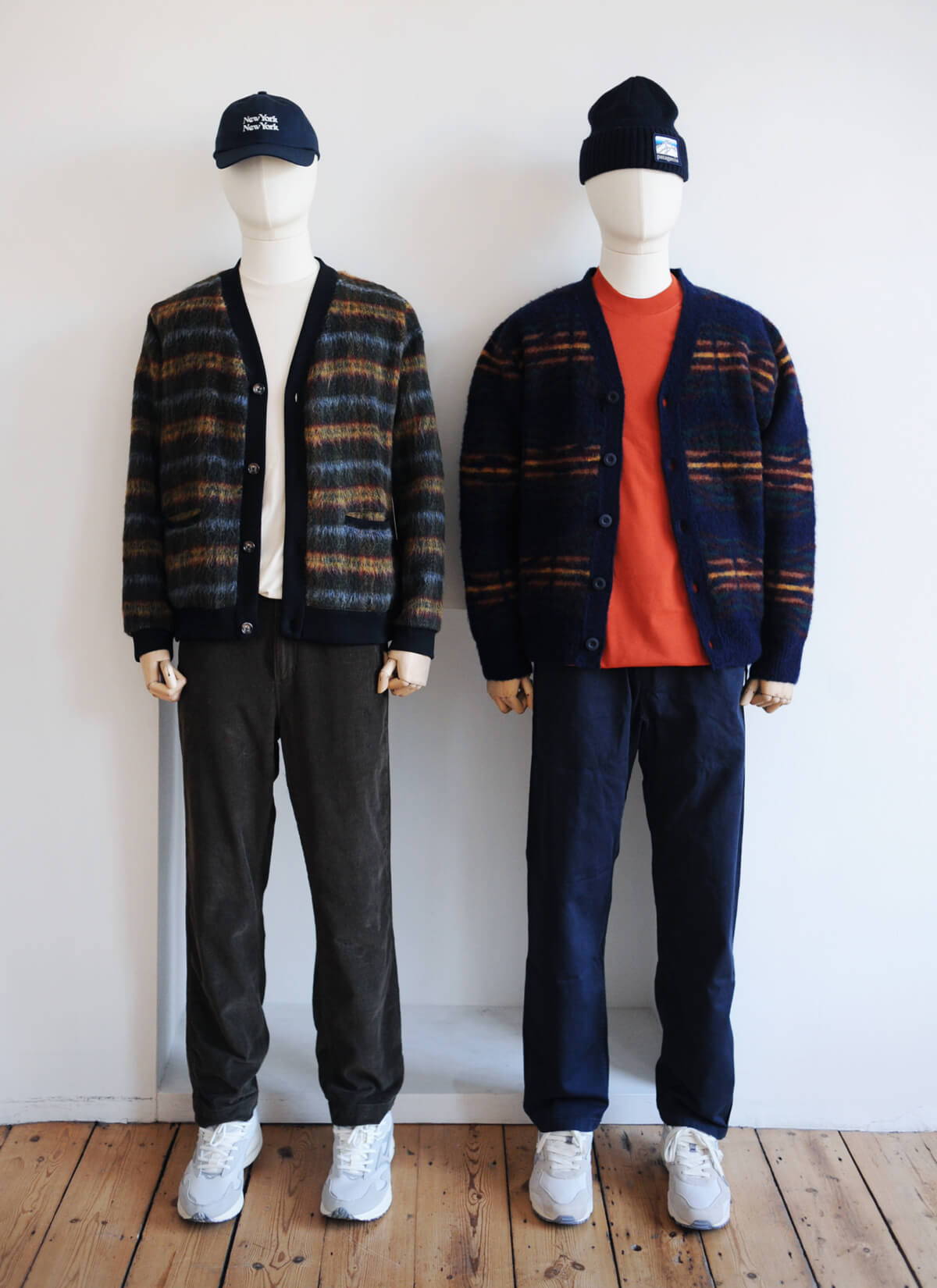 Two mannequins styled with statement knitwear for the festive season.