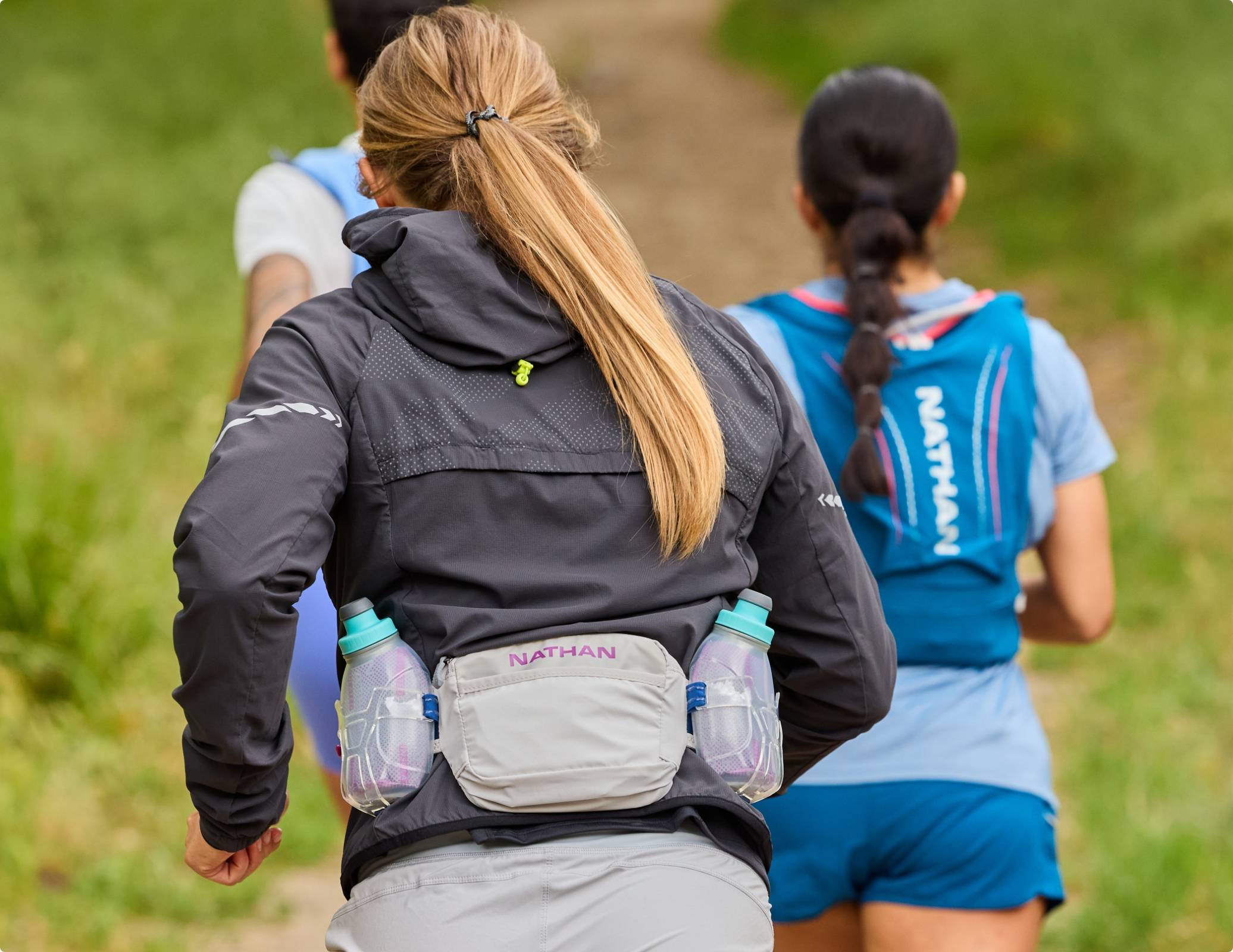 Female runner wearing a Nathan hydration belt