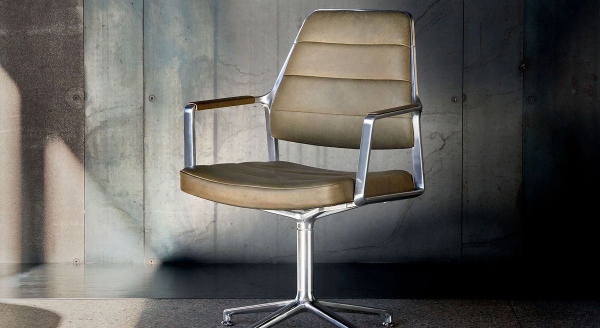 Stylish swivel chair with leather upholstery against a textured background.