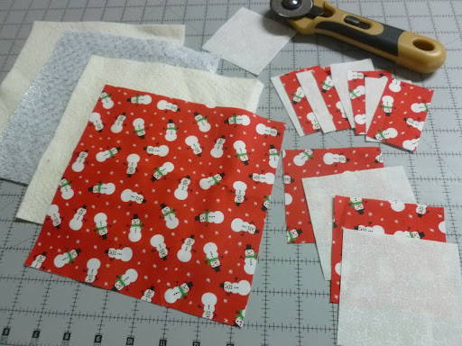 square fabric pieces for a churn dash block
