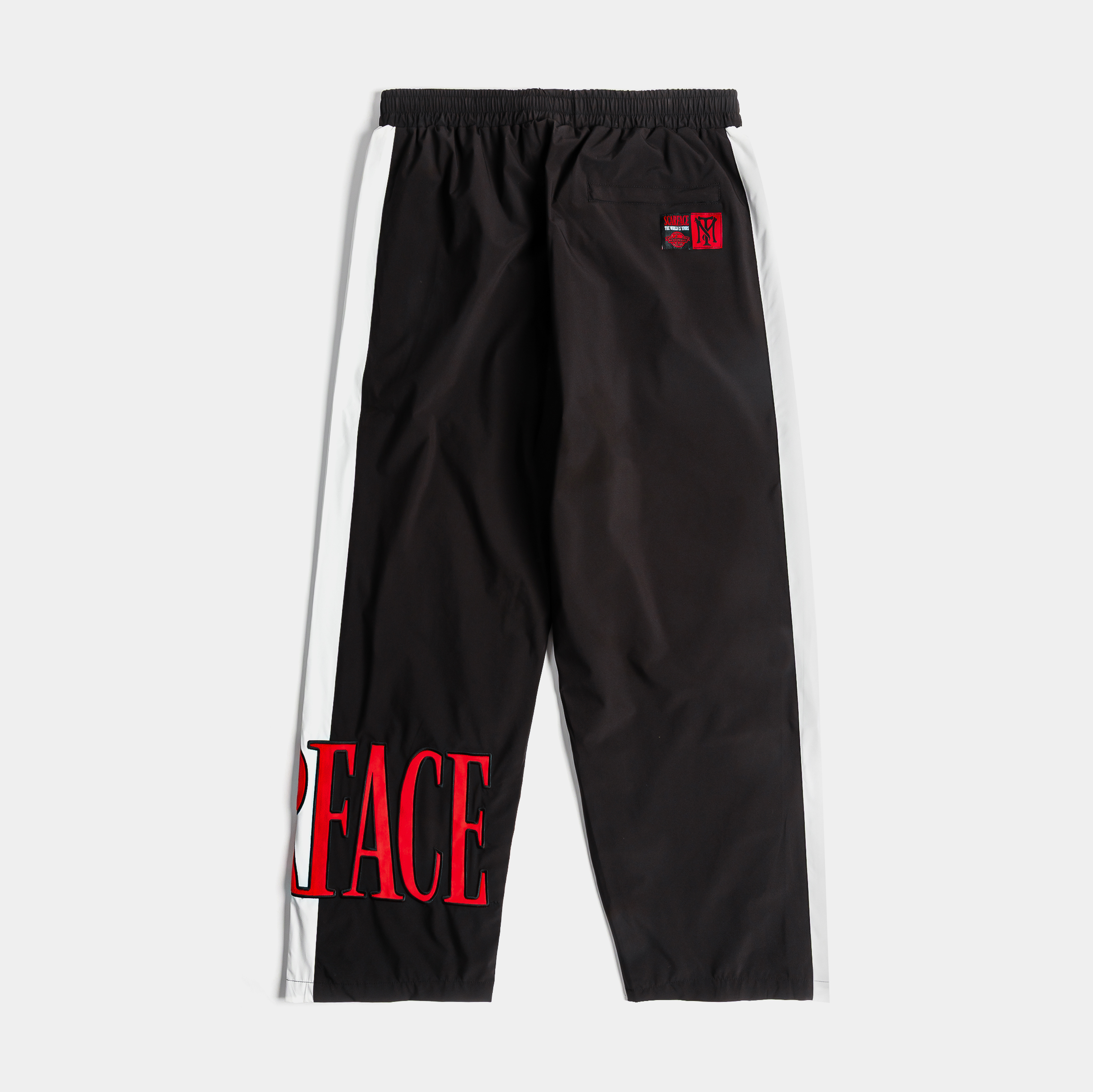 Black athletic pants with white stripes and a logo.
