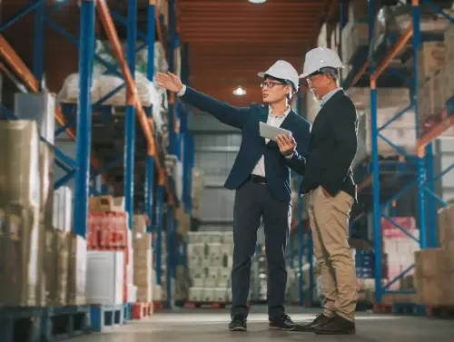 Two men in warehouse