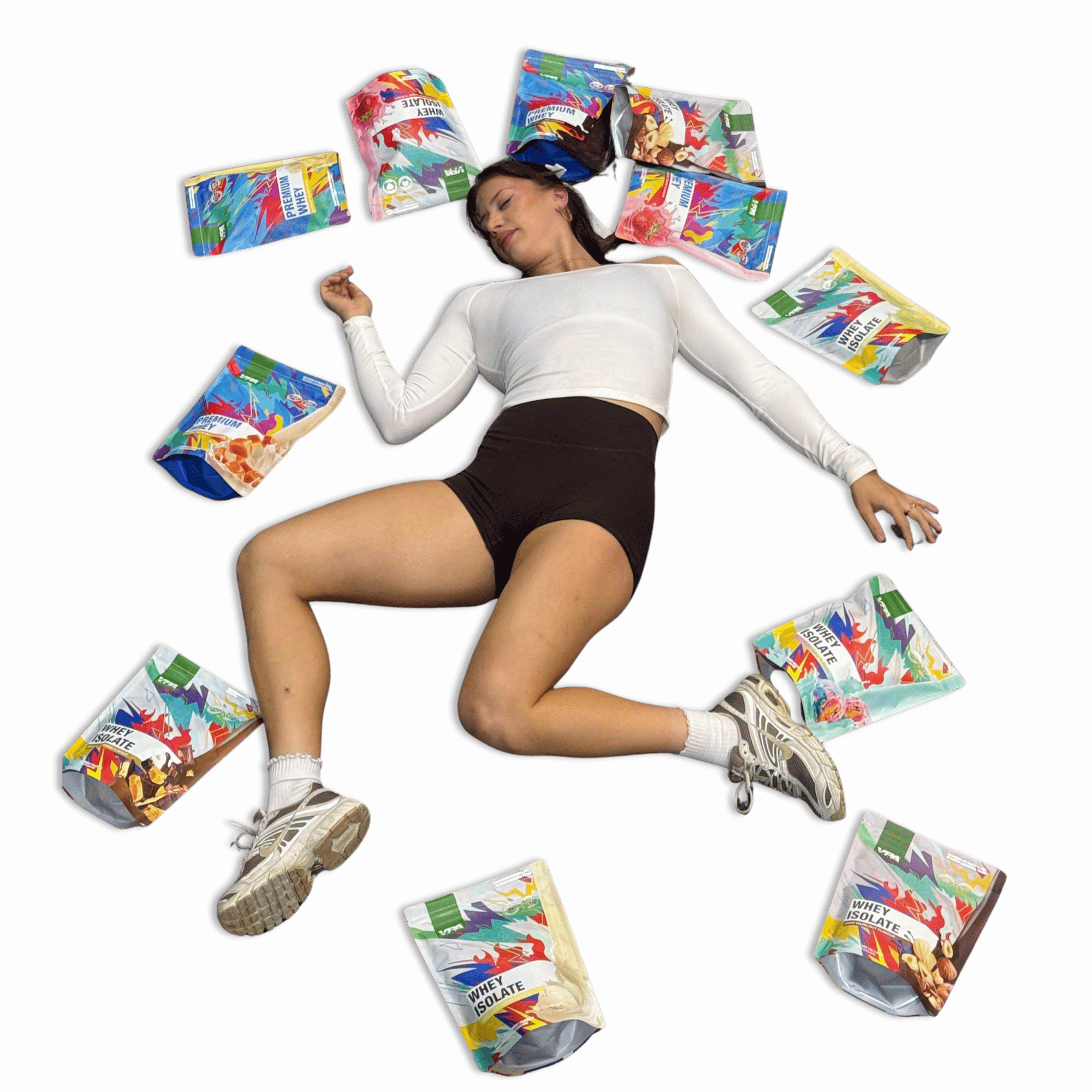 Person lying on the ground surrounded by colorful snack bags.