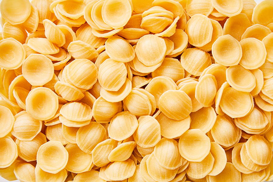Close-up image of many pieces of orecchiette pasta