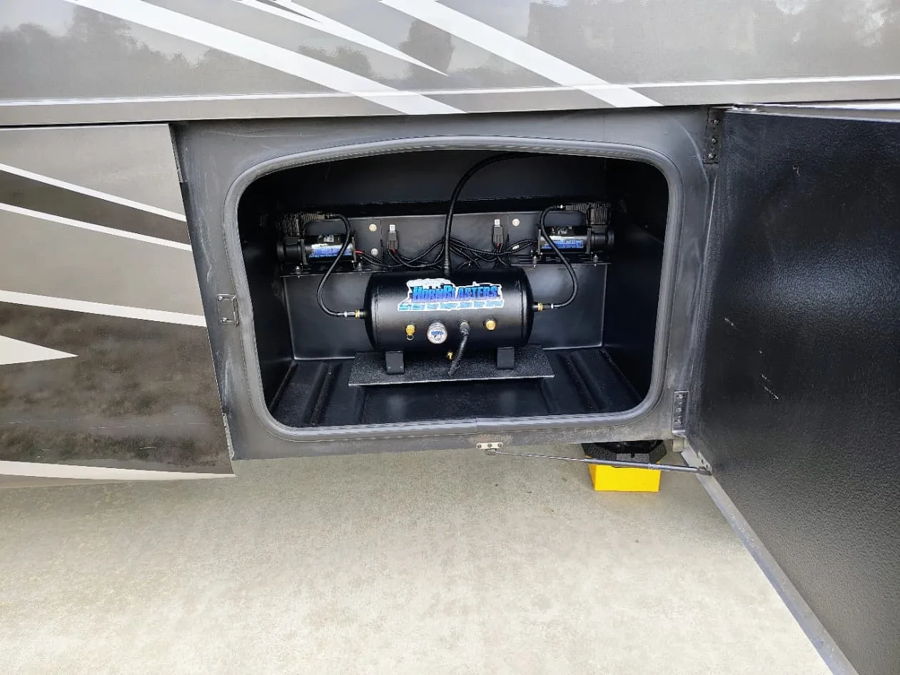 Storage compartment HornBlasters air tank dual compressors pressure gauge open bay door Gary's 2022 Thor RV Challenger 37DS Shocker XL S6 upgrade gallery photo 2