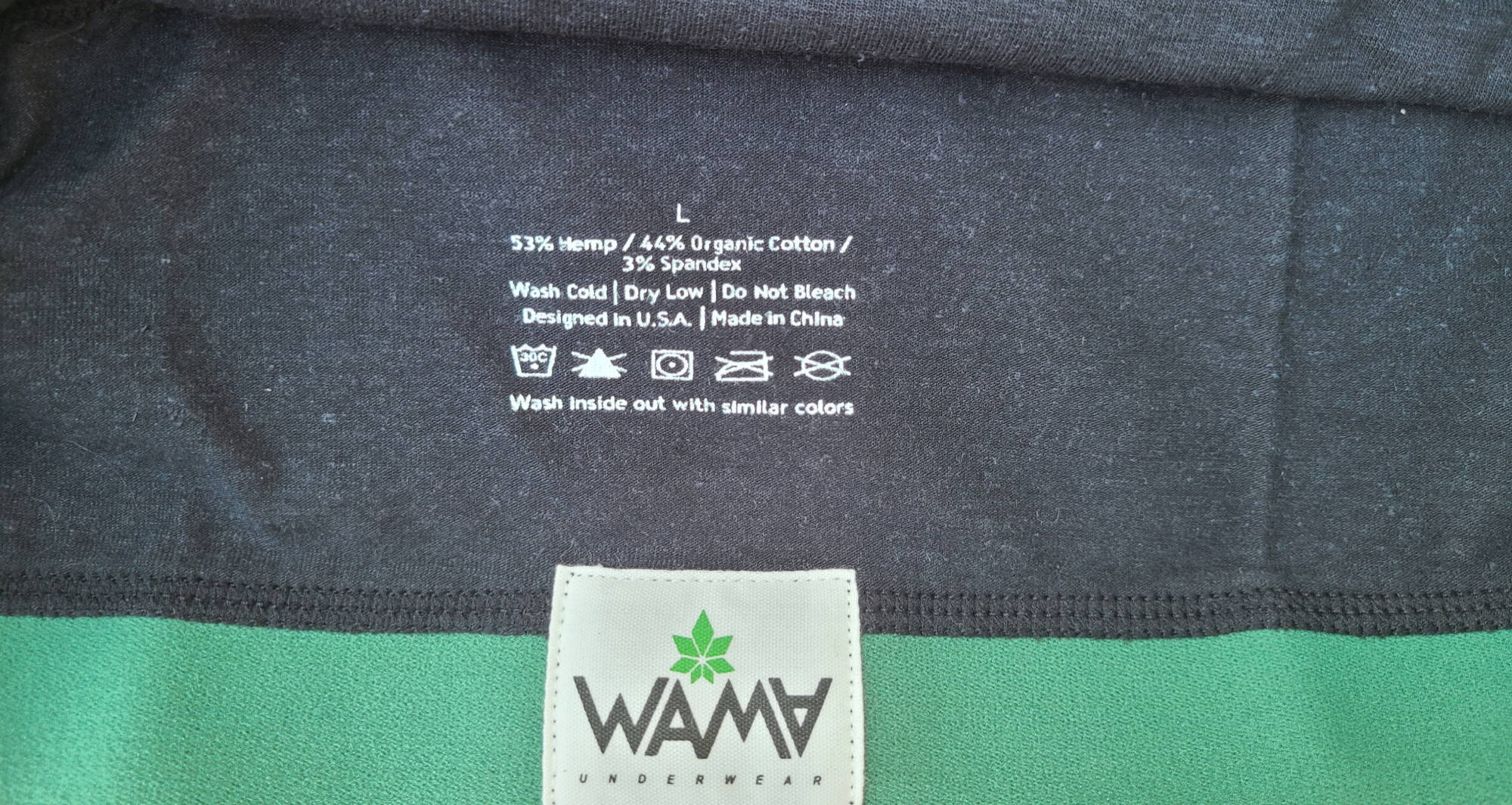 The inside of a WAMA hemp bra shows the fabric content and washing instructions.