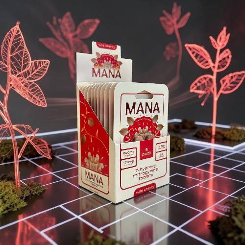 A package of Mana cards with glowing plants in the background.