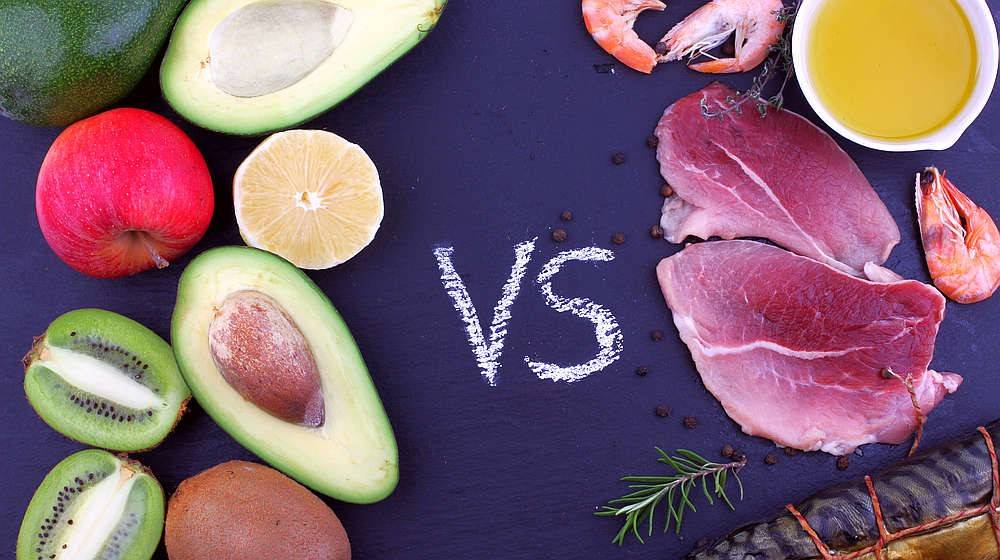 Delicious food composition of meat, seafood product with oil opposite vegetables and fruit | Vegan Collagen Builder Vs Animal-Based Collagen Supplements: Which Is Best For You? | is collagen vegan | Featured