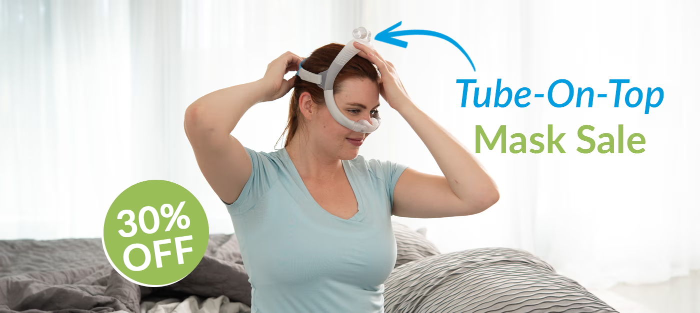 Woman adjusting a mask, promoting a 30% off sale on Tube-On-Top masks.