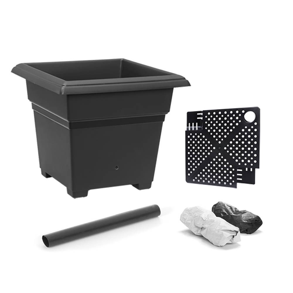 A black EarthBox Root & Veg container gardening system which comes with the container, aeration screen, water fill tube, and 2 mulch covers.