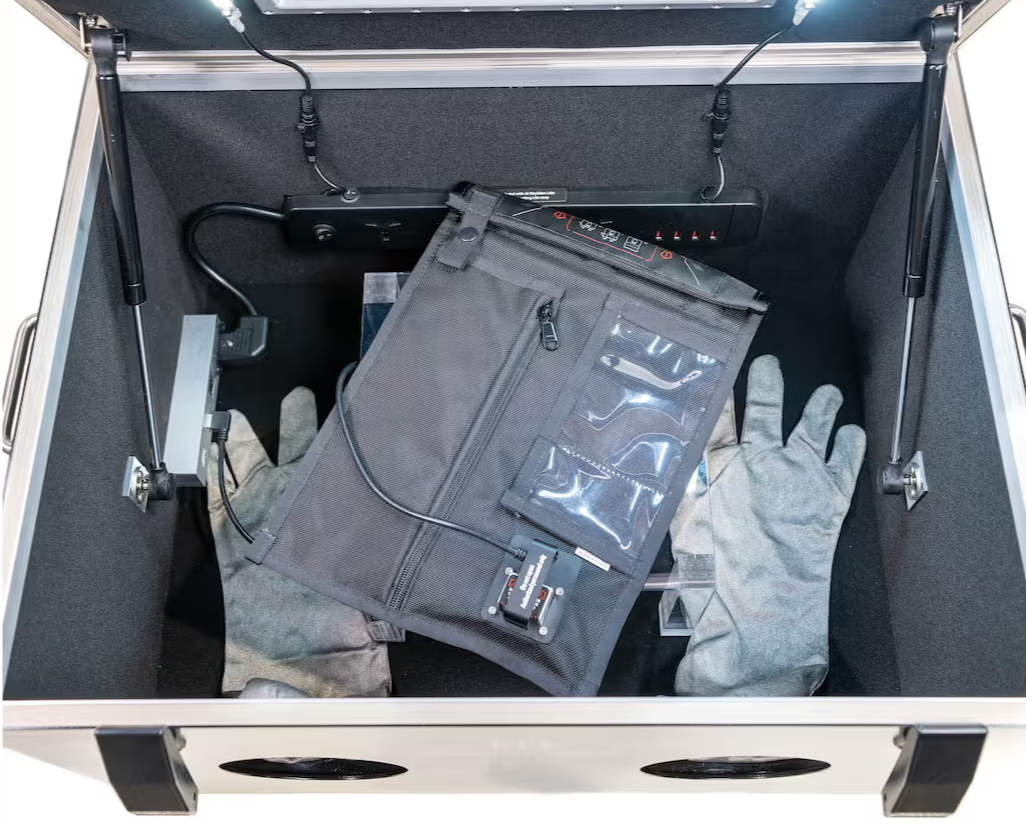 Opening a NeoLok faraday bag with conductive gloves inside the sealed BlockBox Lab XL as a transfer chamber