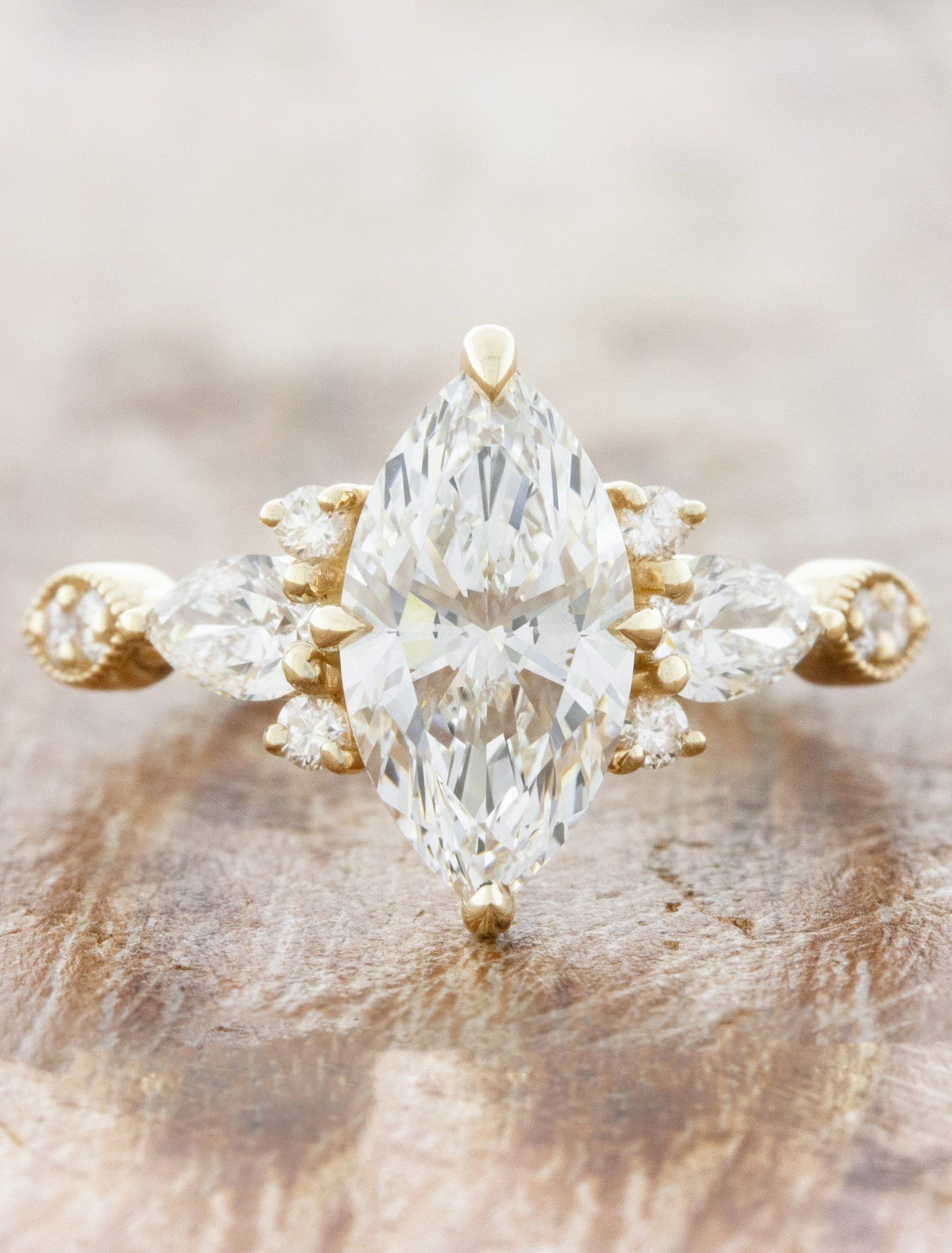 caption:Shown with 1.50ct marquise diamond in 14k yellow gold