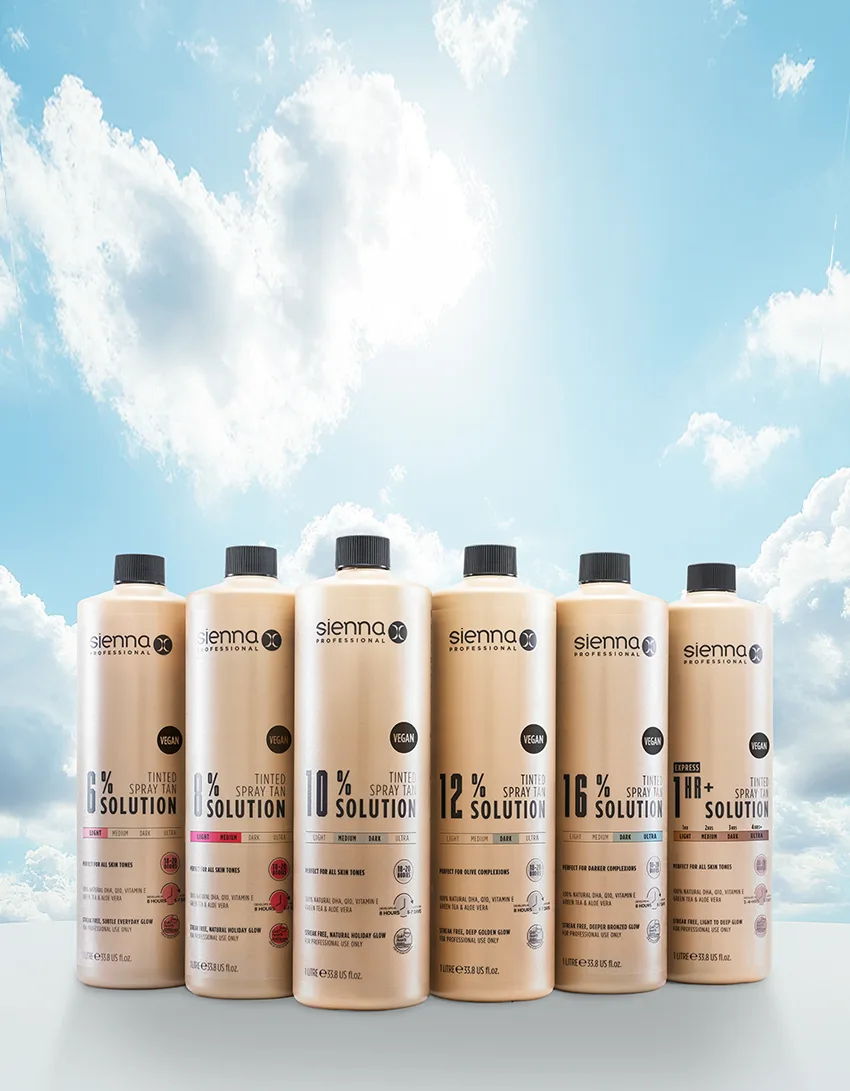 Bottles of hair solution against a blue sky with clouds.