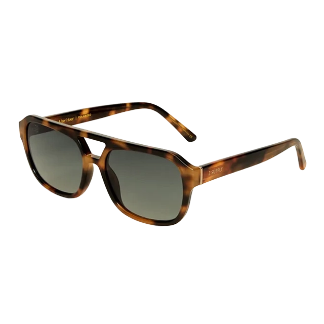 Tortoiseshell sunglasses with dark lenses and stylish wide frames.