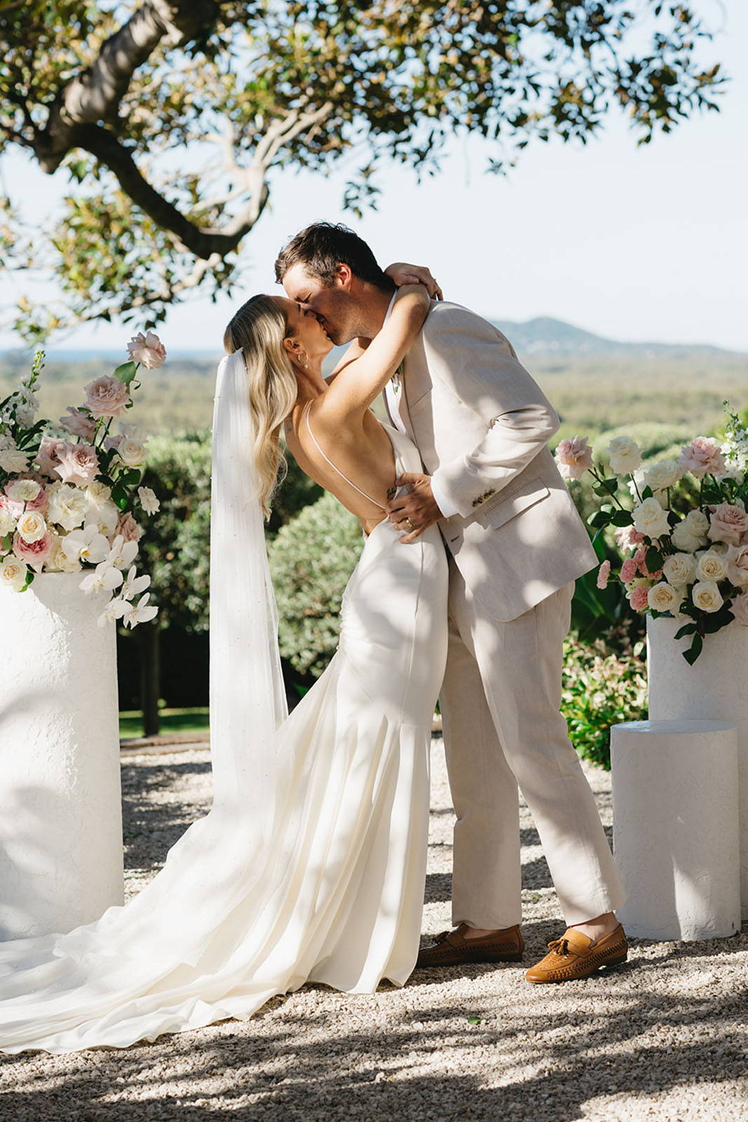 Bride and groom, sharing a kiss