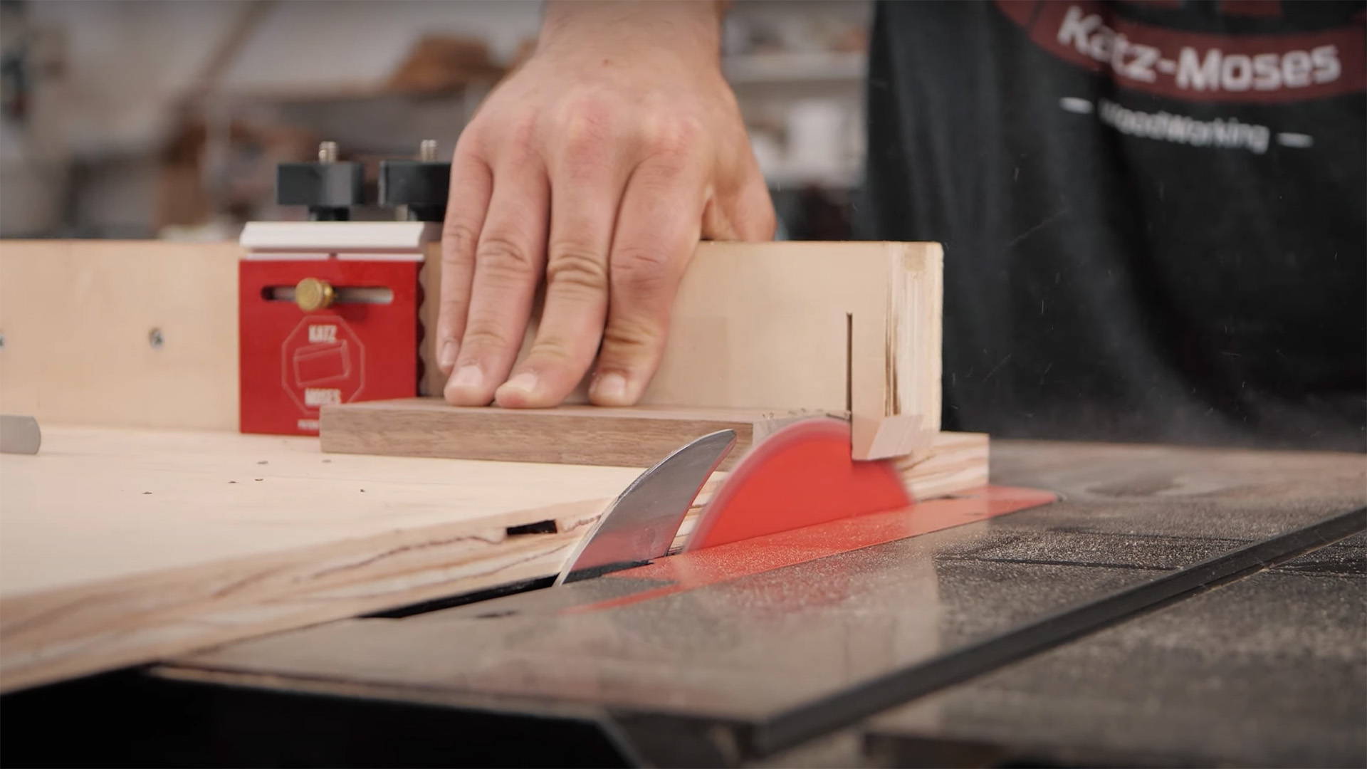 cutting wood on a table saw crooscut sled with stop block
