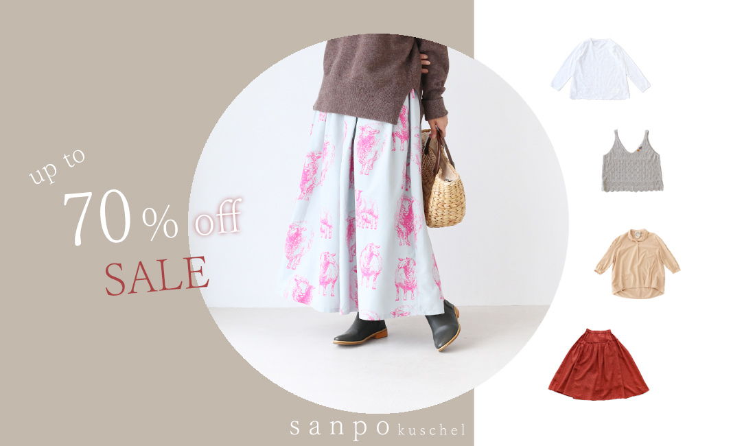 Person wearing a floral skirt promoting a 70% sale on clothing items.