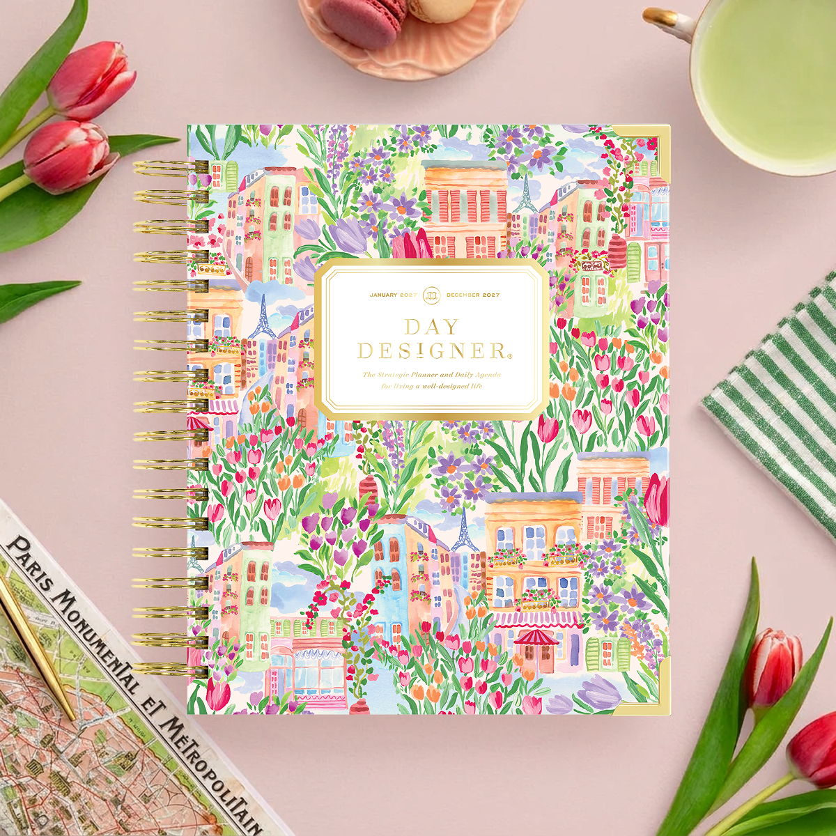 2027 day designer planner featuring buildings, flowers, and cityscape