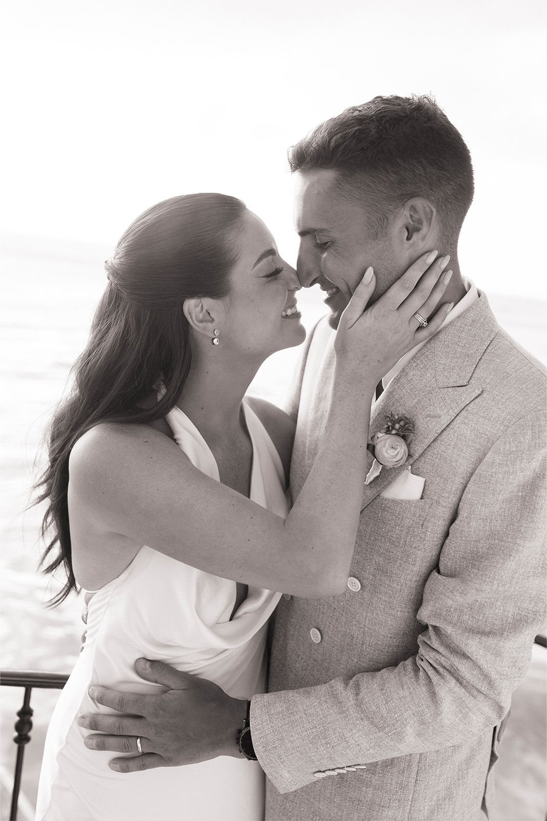 Couple embracing and kissing in a romantic setting.