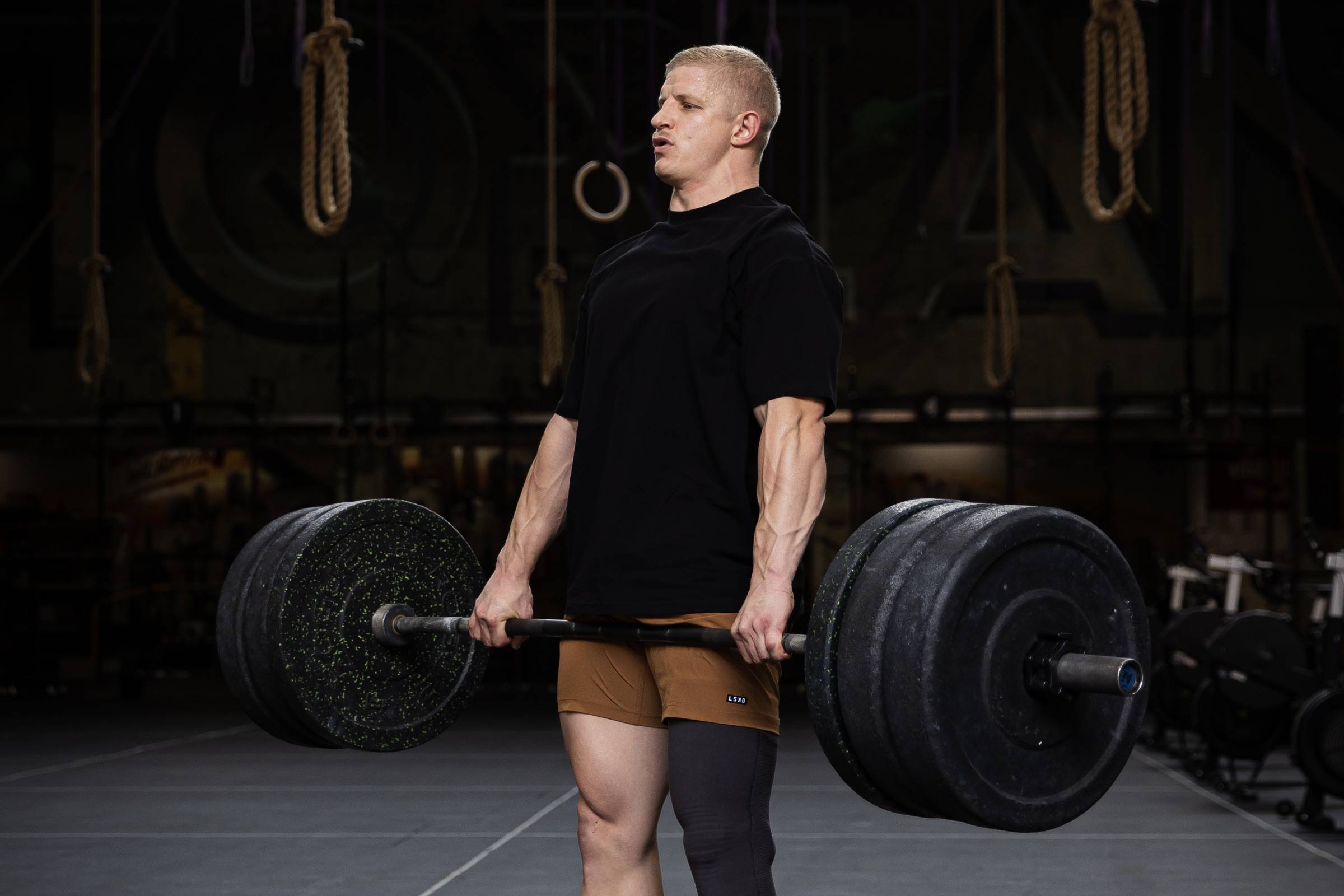 man lifting a barbell