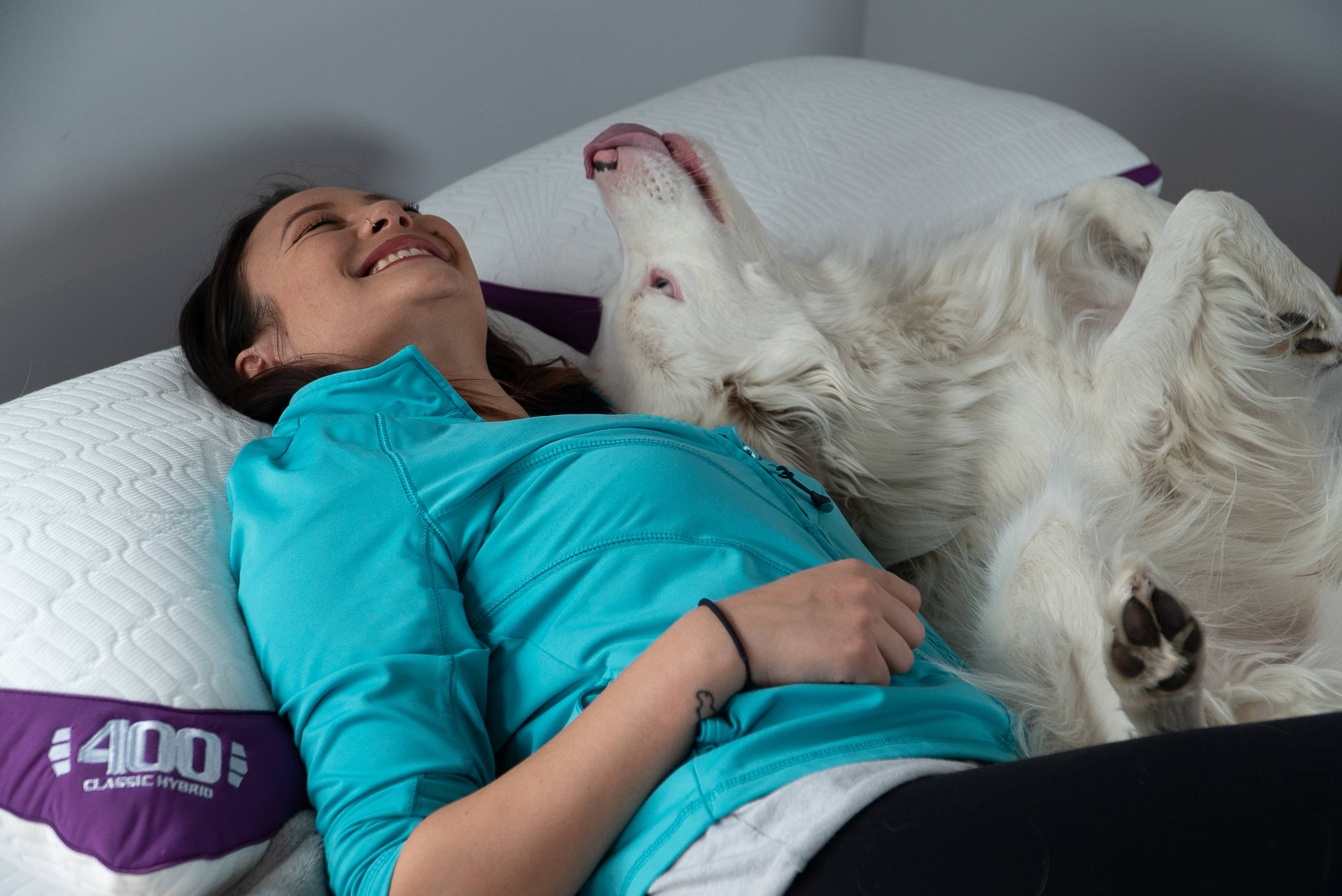 What is Nordic Chill. woman with dog on 400 cooling pillow and advanced memory foam mattress