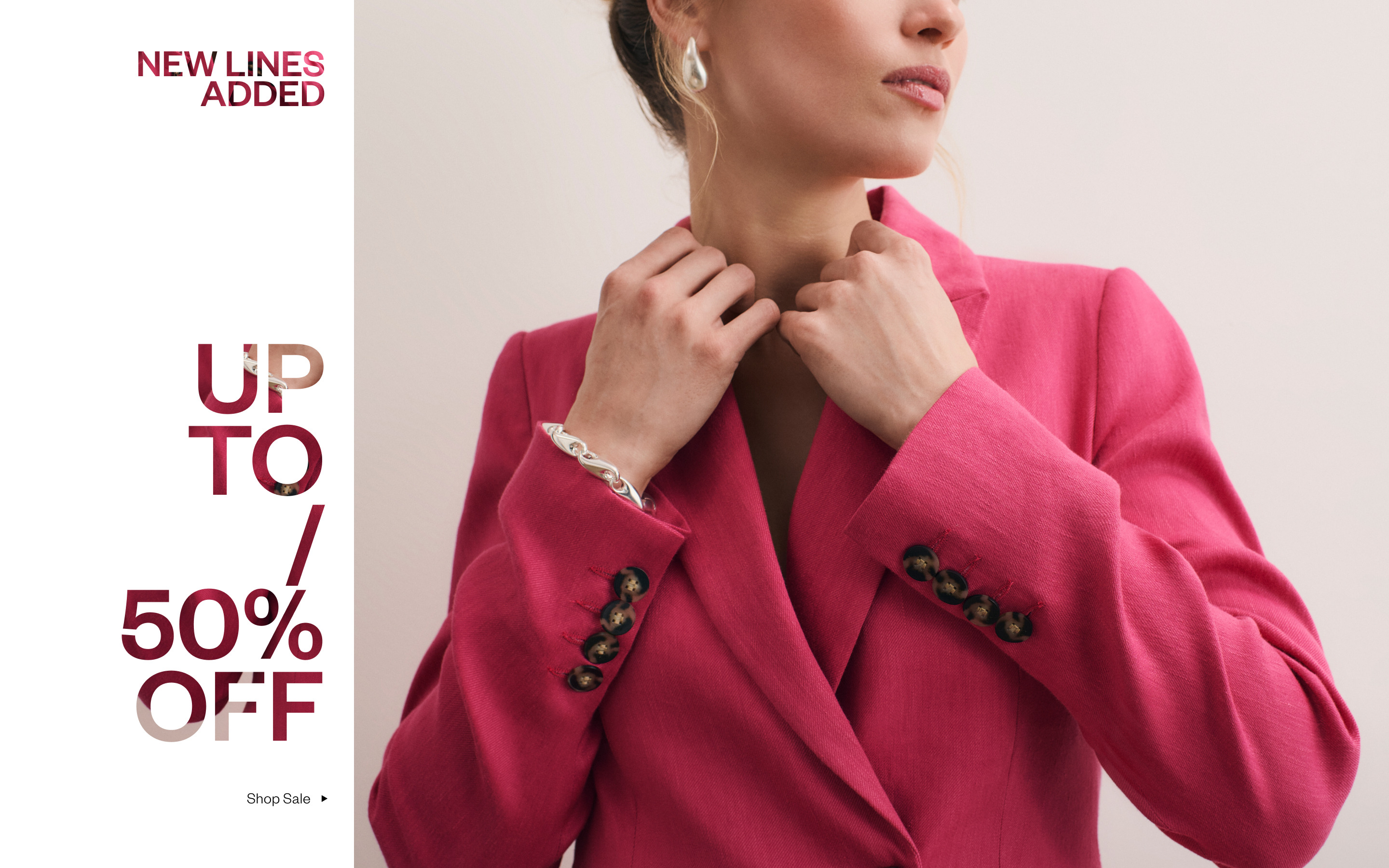 Woman in pink blazer promoting a sale of up to 50% off.
