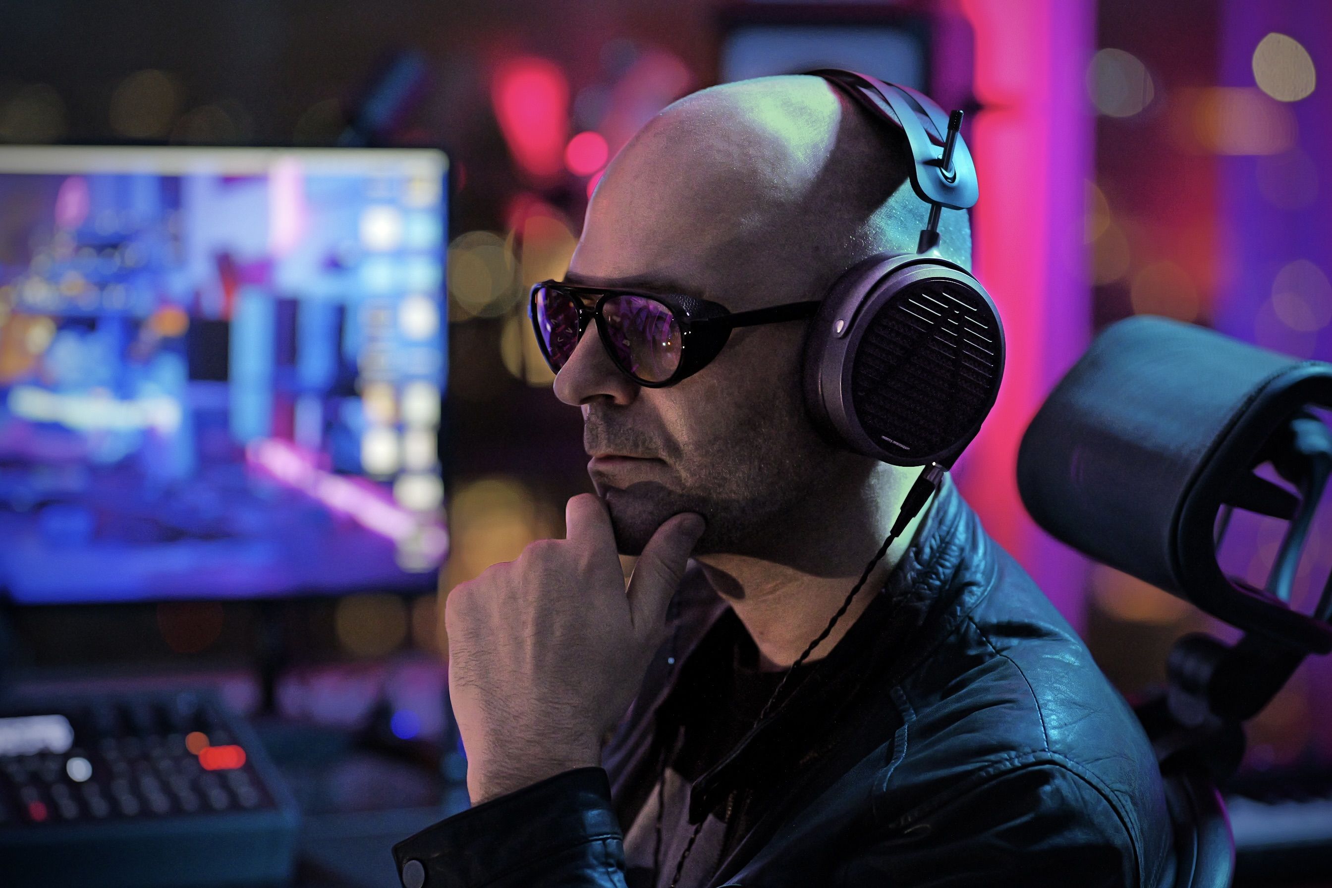 Nikola Feve wearing Audeze MM-500 headphones mixing in the studio