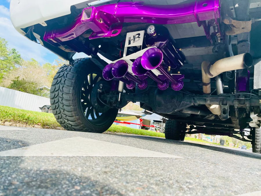 Train horn bells and bracket mounting in spare tire well on Glenn's 2014 Sierra 1500 photo 3