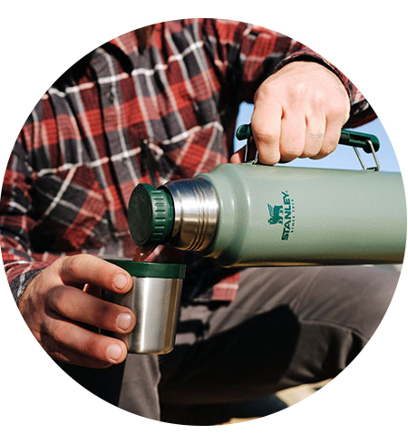 Stanley Classic  Legendary Bottle Being Used By A Man