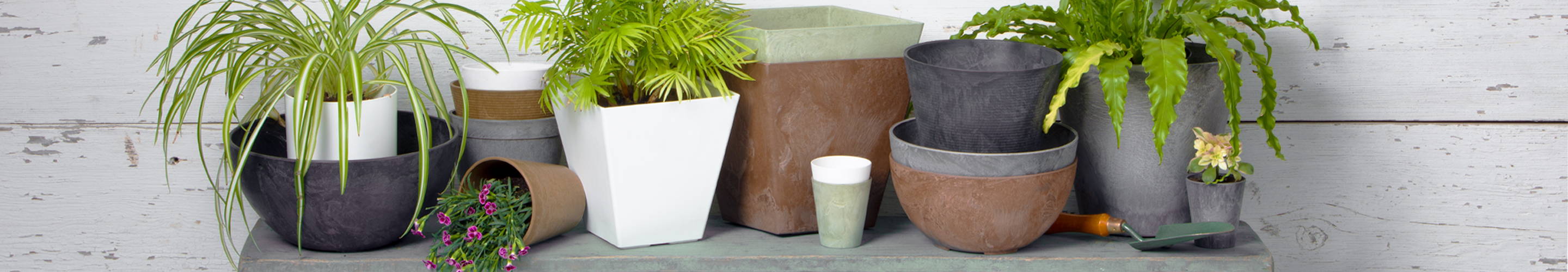 Various sizes, shapes, and colors of our Artstone planters